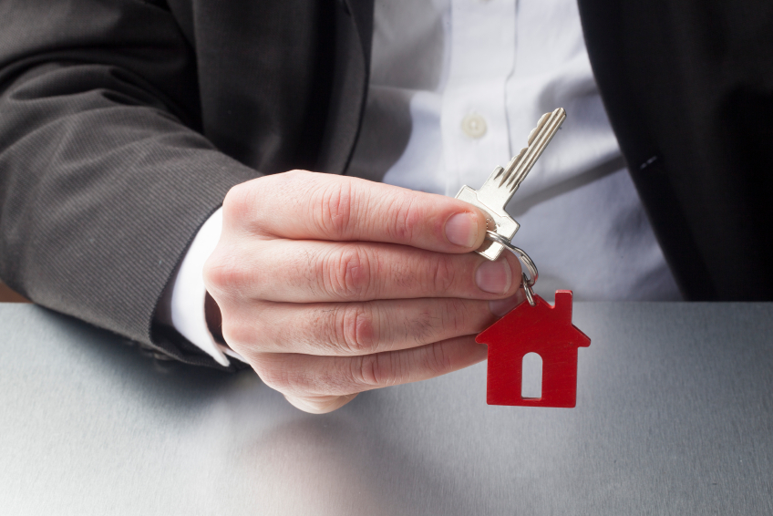 professional giving a key to your property