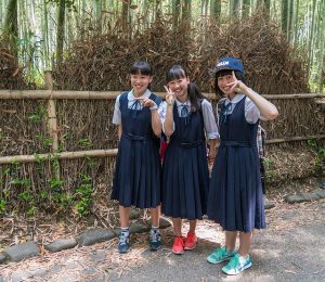 Image is of three female Japanese students.