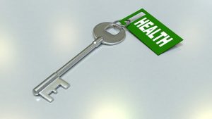 Image is of a key with a tag attached which says Health.