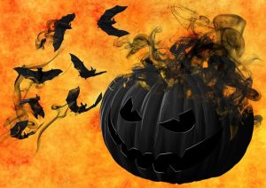 Image is of an illustrated black pumpkin on an orange background with bats flying around it.