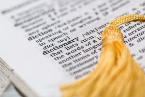 Image is a close up of the page in a dictionary where the word dictionary is defined.