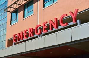 Image is of a building with the word Emergency on it.