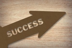 Image is an arrow pointing up with the word "success" inside of it.