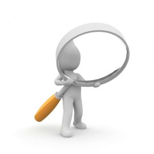 Image is a featureless cartoon man holding a giant magnifying glass.