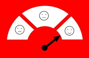 Image is a customer satisfaction meter with the arrow pointing at a smiley face.