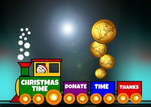 Image is a cartoon train that has the words "Christmas Time," "donate," "time," and "thanks" written on the train cars.