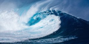 Image is a huge ocean wave breaking.