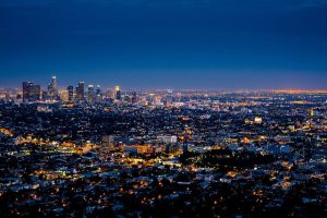 Image is the Los Angeles County skyline at dusk.