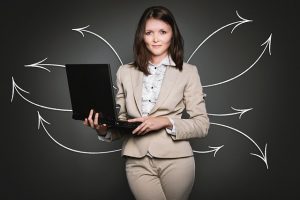 Image is a property manager holding a computer.