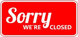 Image is a Sorry We're Closed sign.
