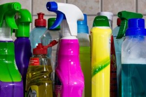 Image is a close up of different disinfectants and household cleaners.