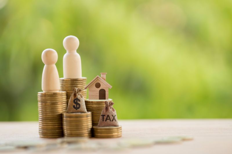 couple and home model on rows of rising coins us dollar bags