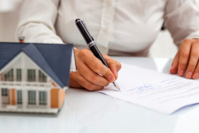 Signing a contract and a model house