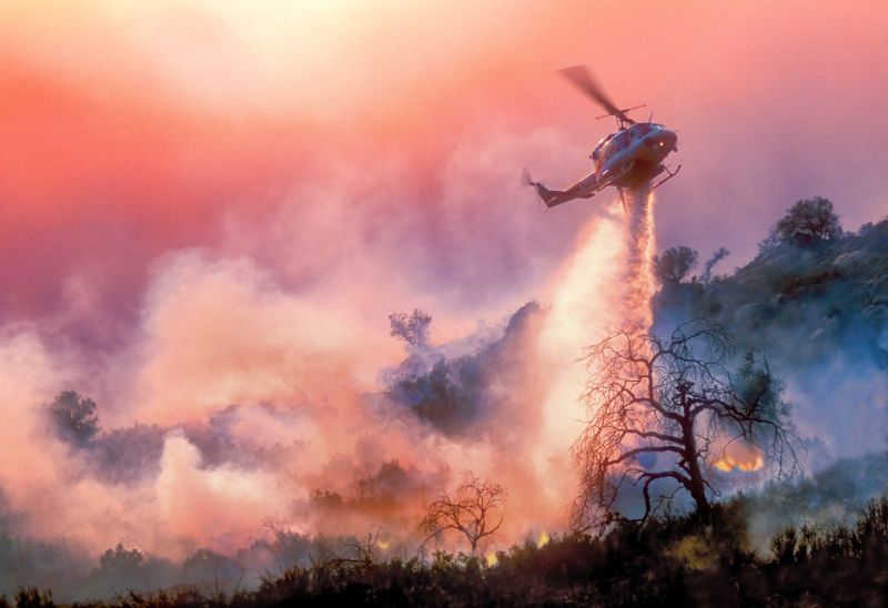 helicopter waterdrop on california wildfire