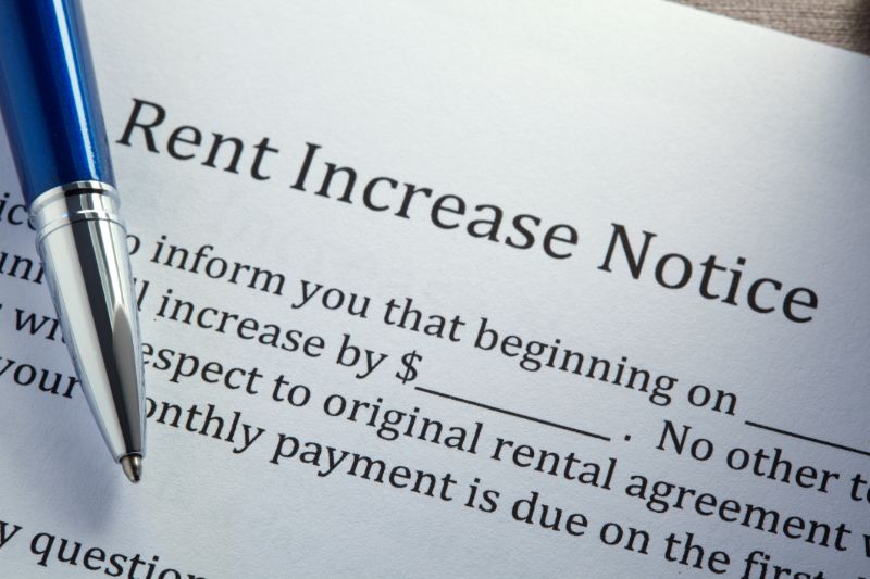 ballpoint pen on top of rental increase notice