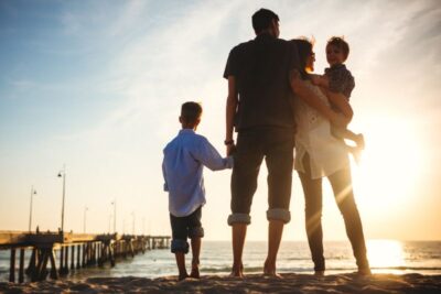 millennial family at the beach