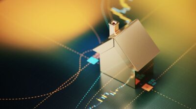 house symbol sitting over a bar graph stock market and real estate concept